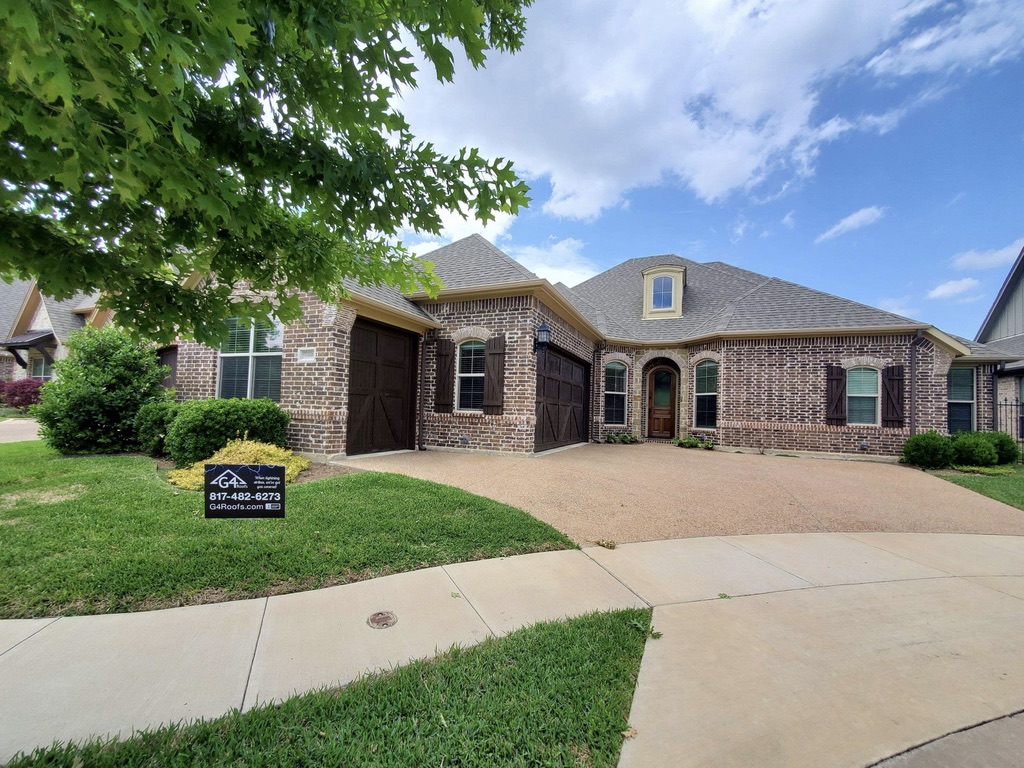 Residential brick house with newly installed roof